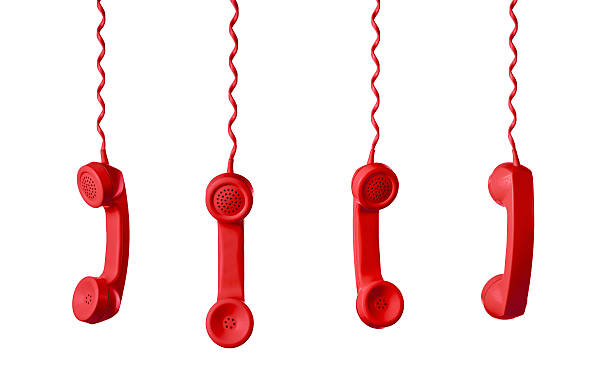 istock Red Telephone Receiver isolated on a white background 604351124