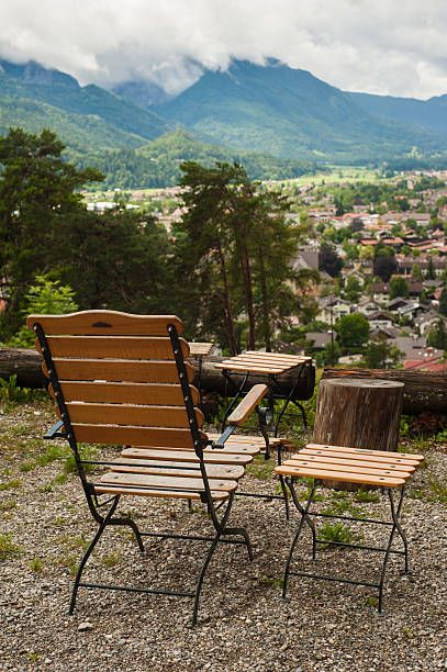 istock Rustic armchair and peaceful mountain view 604351694
