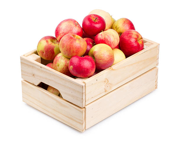 istock Wooden box full of fresh apples isolated 604351842