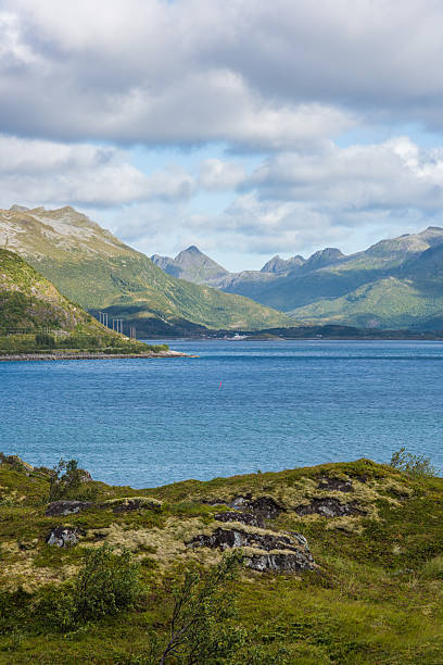 istock Colorful summer landscape with sharp mountain peaks in Norway. 604352938