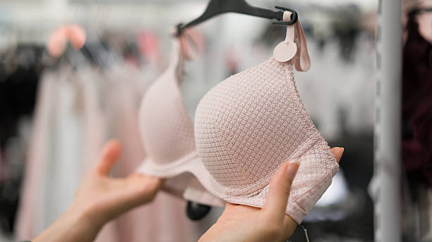Woman in underwear store stock photo