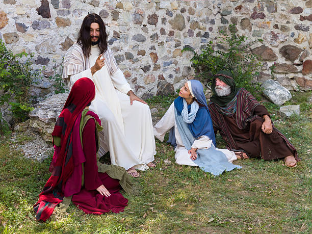 People listening to Jesus Jesus preaching to a group of people - historical reenactment allegory painting stock pictures, royalty-free photos & images
