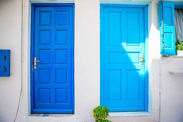 istock Traditional houses withe blue doors in the narrow streets of 604355440