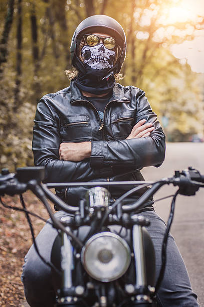 istock Biker man sitting on his motorcycle 604357150