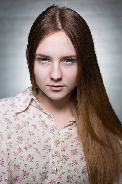 istock Young girl with brown hair 604357584