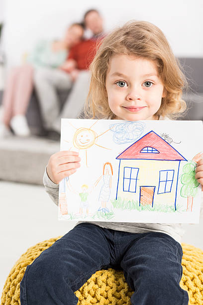 istock Happy family live and on drawing 604357940