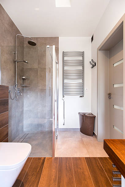 istock Stylish bathroom and modern shower 604358250