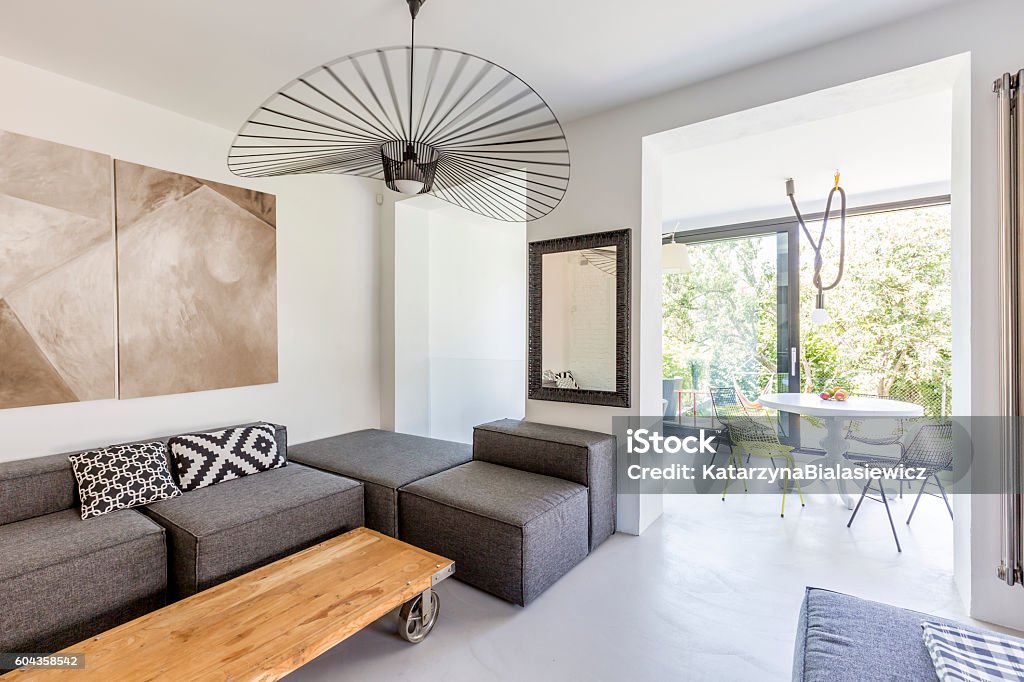 You will love this modern living room Shot of a stylish living room interior with wooden coffee table Apartment Stock Photo