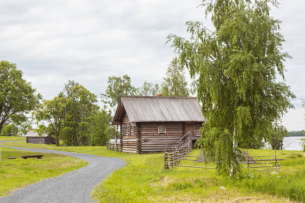 Old Village Log Houses in museum Small Karelians near Arkhangelsk, Russia. Winter time