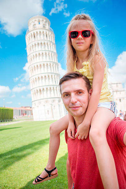 istock Family portrait background the Learning Tower in Pisa. Pisa - 604360308