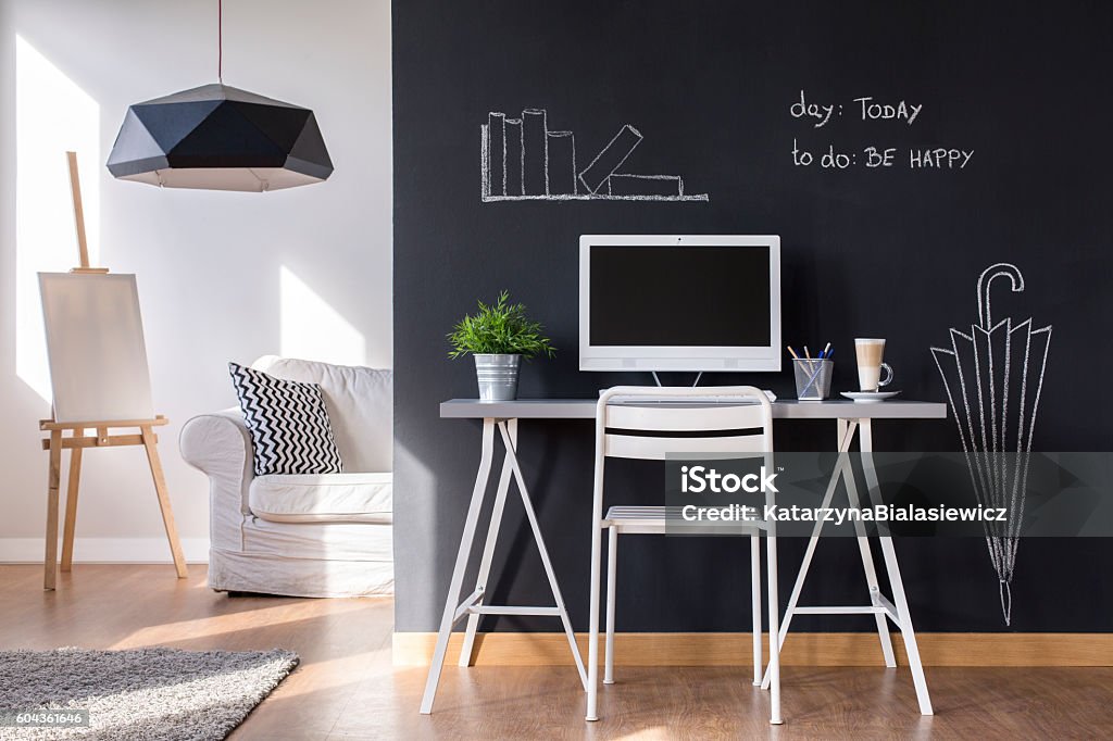 Minimalist work area at home Minimalist modern work space at home with blackboard wall Chalkboard - Visual Aid Stock Photo