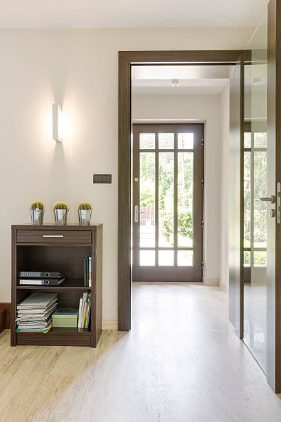istock Sunny anteroom with transparent door 604362468