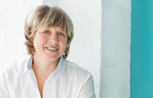 istock Middle aged woman looking at camera 604362928