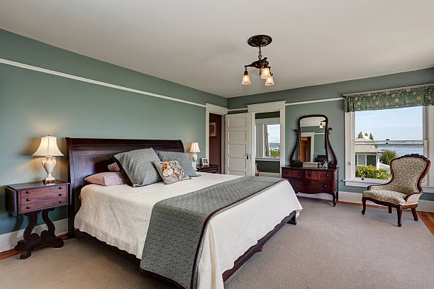 istock Luxury bedroom interior in blue tones and king size bed. 604362970