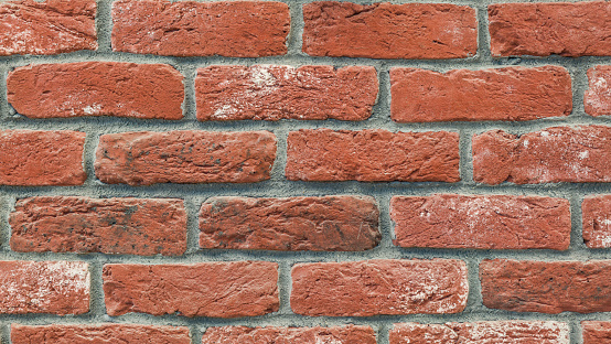 Red brick wall close-up horizontal outdoors shot.