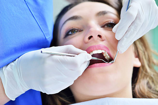 Woman lying in the dentist's chair having a checkup