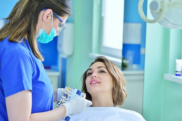 istock Woman lying in the dentist's chair having a checkup 604366622