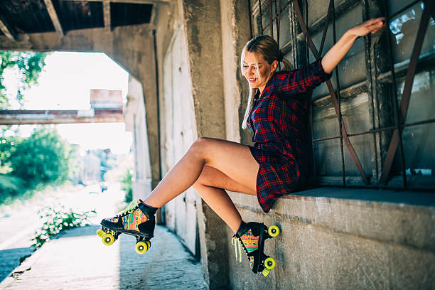istock Girl sitting with roller skates 604367010