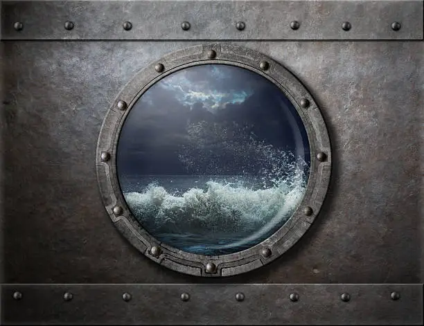 old ship metal porthole or window with sea storm behind it