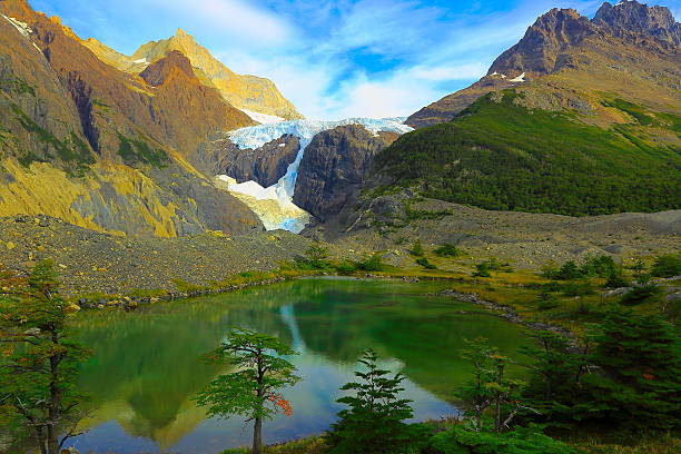 lake and glacier los perros  - torres del paine, patagonia - mountain reflection non urban scene moody sky imagens e fotografias de stock