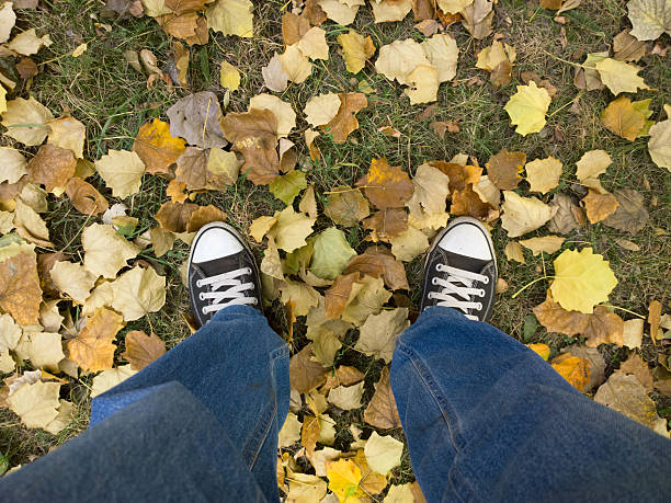 istock Feet on the yellow leaves. 604377164