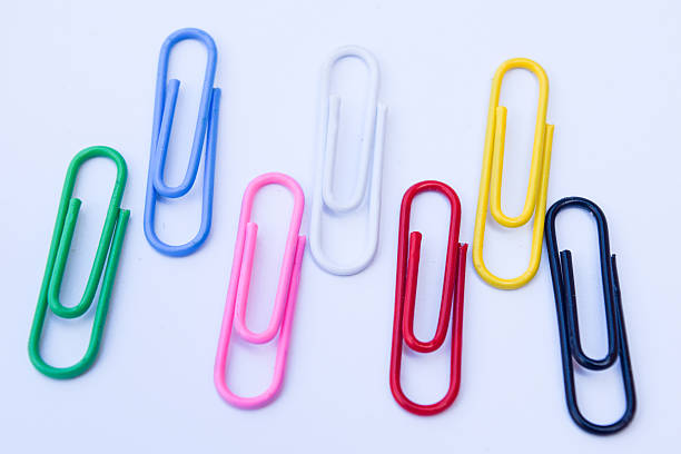 istock Collection of colorful paper clips with space for texture 604377380