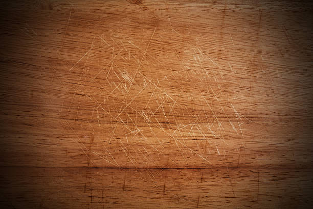 istock Old scratched wooden cutting board texture 604379882