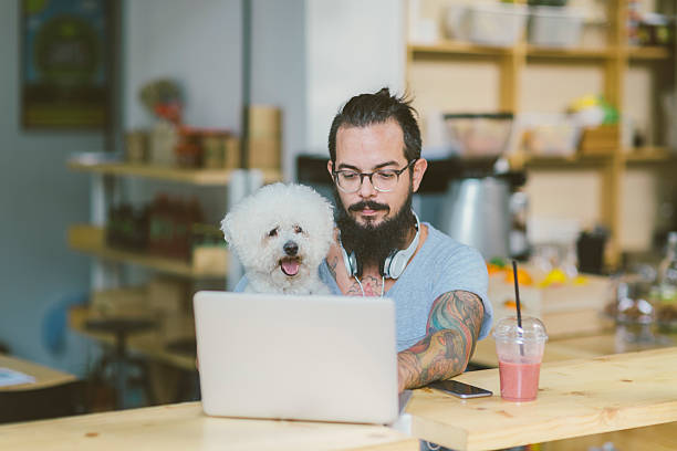 istock Beard Man Sitting In Cafe With His Dog 604380790