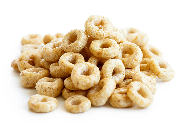 istock Heap of honey cheerios isolated on white. 604381816