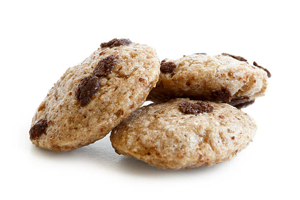 istock Three chocolate chip cookies cereal isolated on white. 604381848