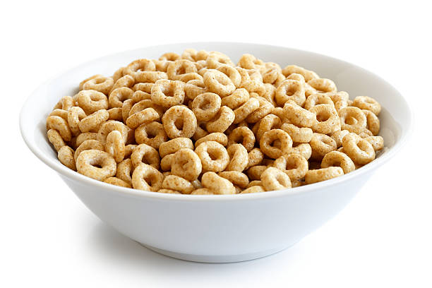 istock Bowl of honey cheerios isolated on white. 604382080