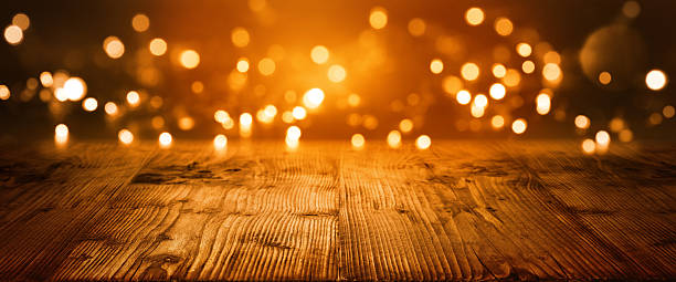 Christmas Bokeh background Christmas Bokeh background with empty wooden table funkeln stock pictures, royalty-free photos & images