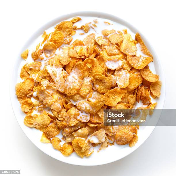 Bowl Of Cornflakes In Milk Isolated On White From Above Stock Photo - Download Image Now