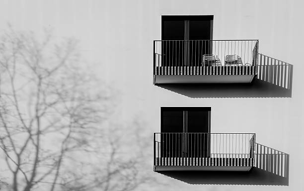 low angle view of balconies - black and white architecture surrounding wall wall imagens e fotografias de stock