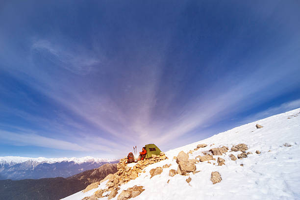 istock Winter camping in the mountains with a backpack and tent. 604778846