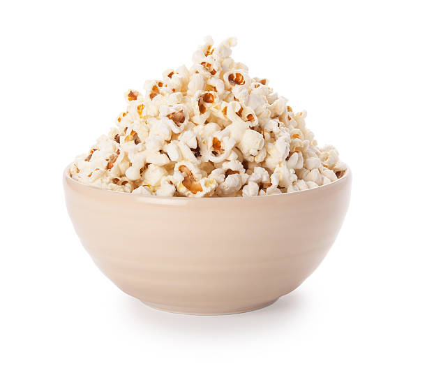 Bowl of popcorn isolated on white background Bowl of popcorn isolated on white background popcorn snack bowl isolated stock pictures, royalty-free photos & images