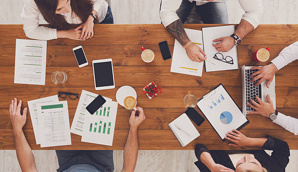 istock Group of busy business people working in office, top view 604796108