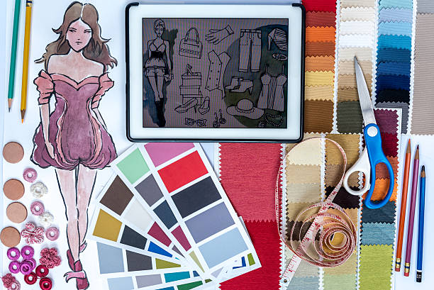 istock Fashion designer studio with sketch of clothes and samples 604813488