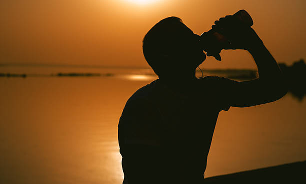 istock young man with a shaker water outdoors 604822348