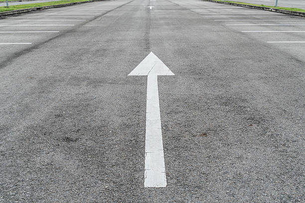 istock Asphalt road with arrow sign 604823358