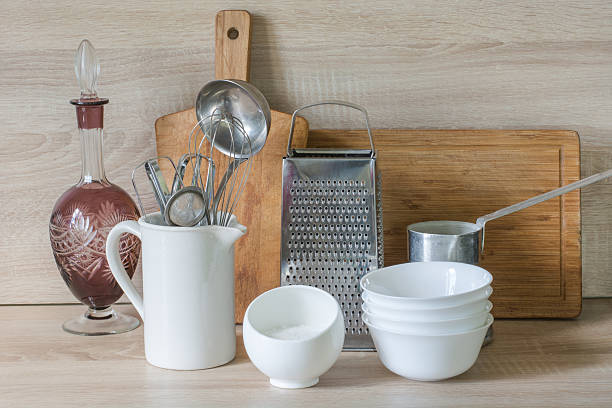 istock Crockery, tableware, utensils and other different stuff on wooden table-top. 604823620