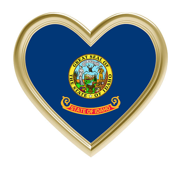 istock Idaho flag in golden heart isolated on white background. 604824366