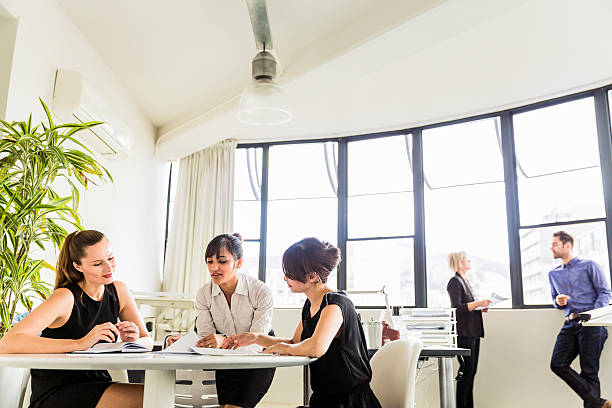 istock Business people discussing in groups at office 604824756