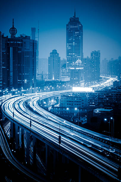 shanghai flyover at night crowded cars driving at flyover,long exposure. car city urban scene commuter stock pictures, royalty-free photos & images