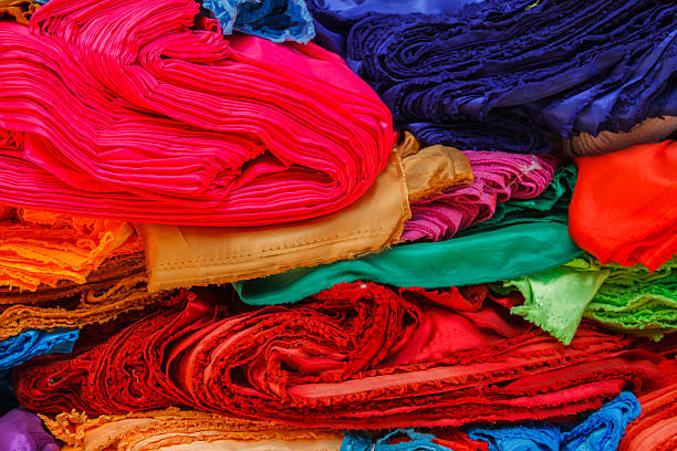 istock Messy pile colorful cloth. 604825284