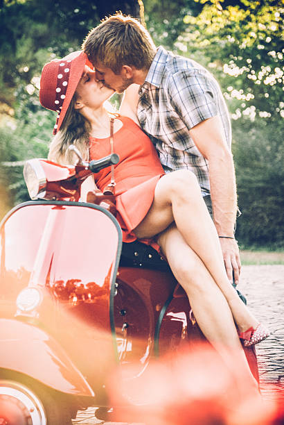 istock Young Couple on a Vintage Scooter 604828494