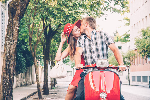 istock Young Couple Exploring the City on a Vintage Scooter 604828826