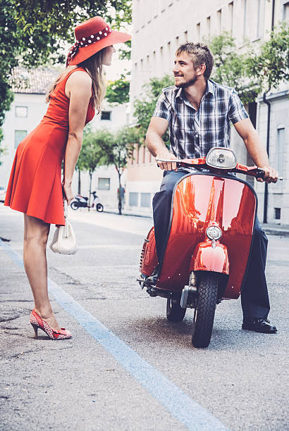 istock Young Woman Picking up a Ride on a Vintage Scooter 604828838