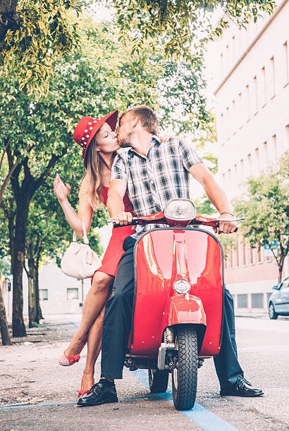 istock Young Couple Exploring the City on a Vintage Scooter 604828920