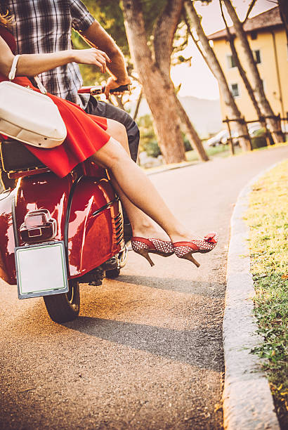 istock Young Couple Riding a Vintage Scooter 604828950
